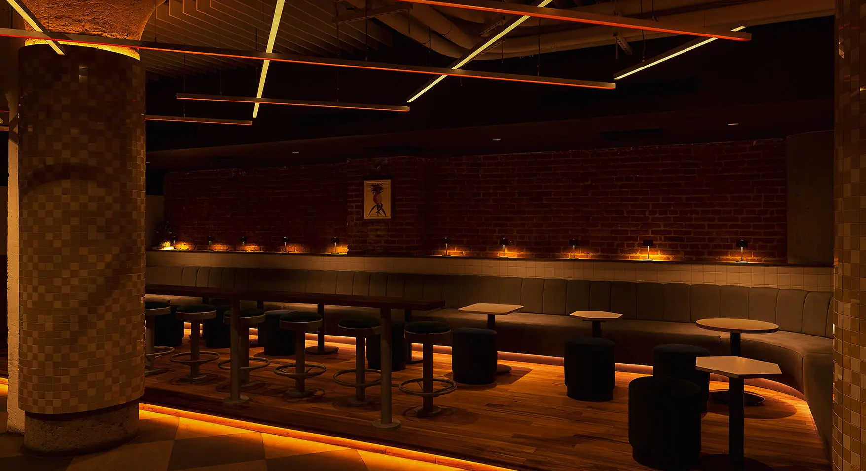 Private event space in Montreal featuring a stylish bar and seating area at Bar Le Mal Nécessaire.