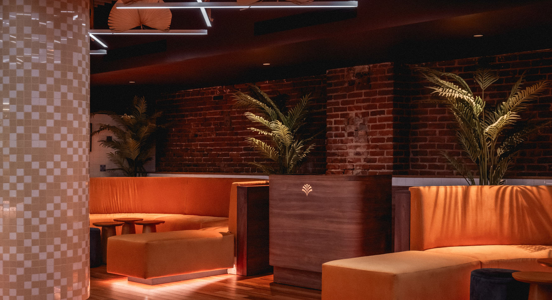 Private events space at Bar Le Mal Nécessaire Montreal featuring modern seating and lighting.